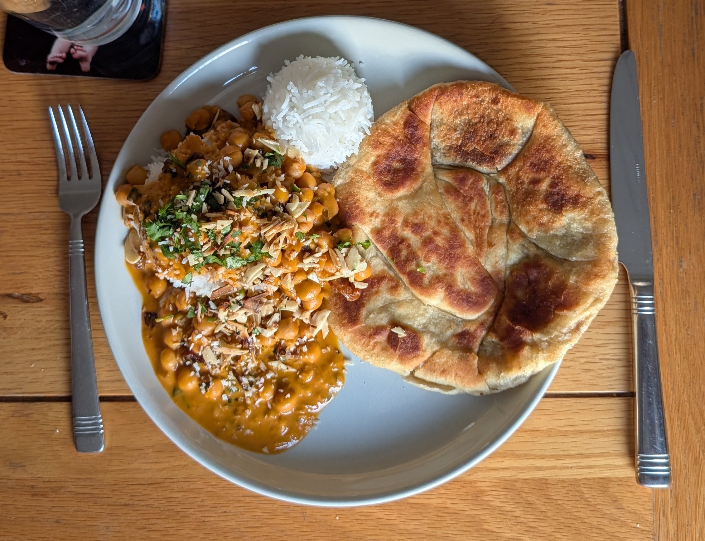 Vegan butter chickpeas
		with home-made Peshwari Naan